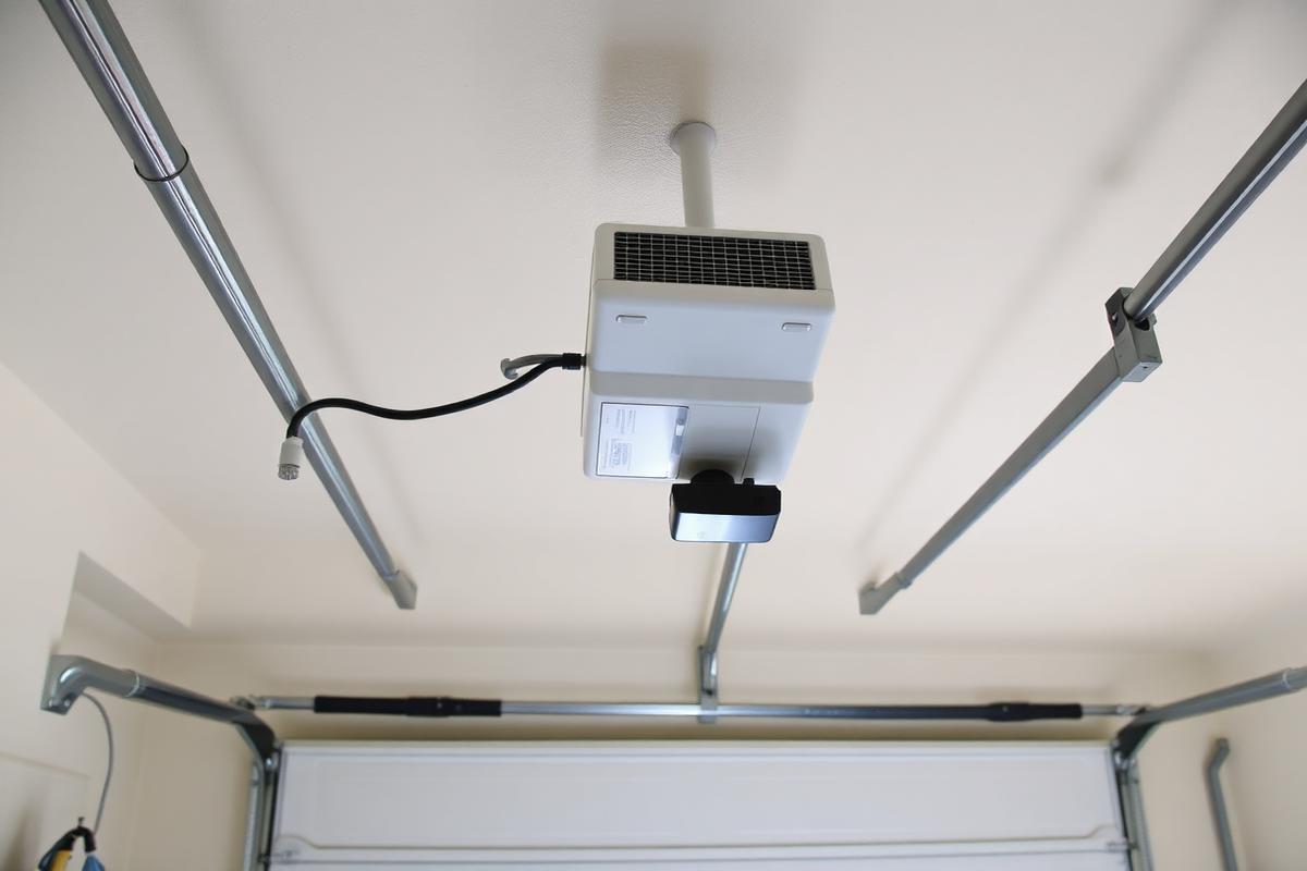 Ceiling mounted residential garage door opener and rail
